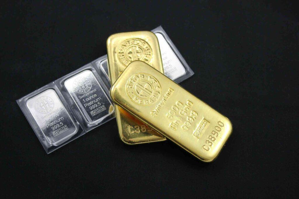 Someone investing in gold and silver bars due to gold revaluation