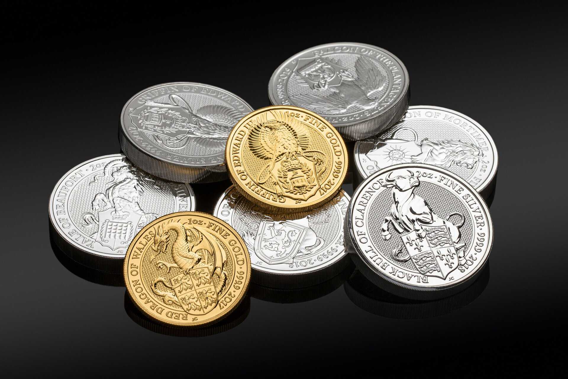 Private Investments - Silver and Gold Coins on a table